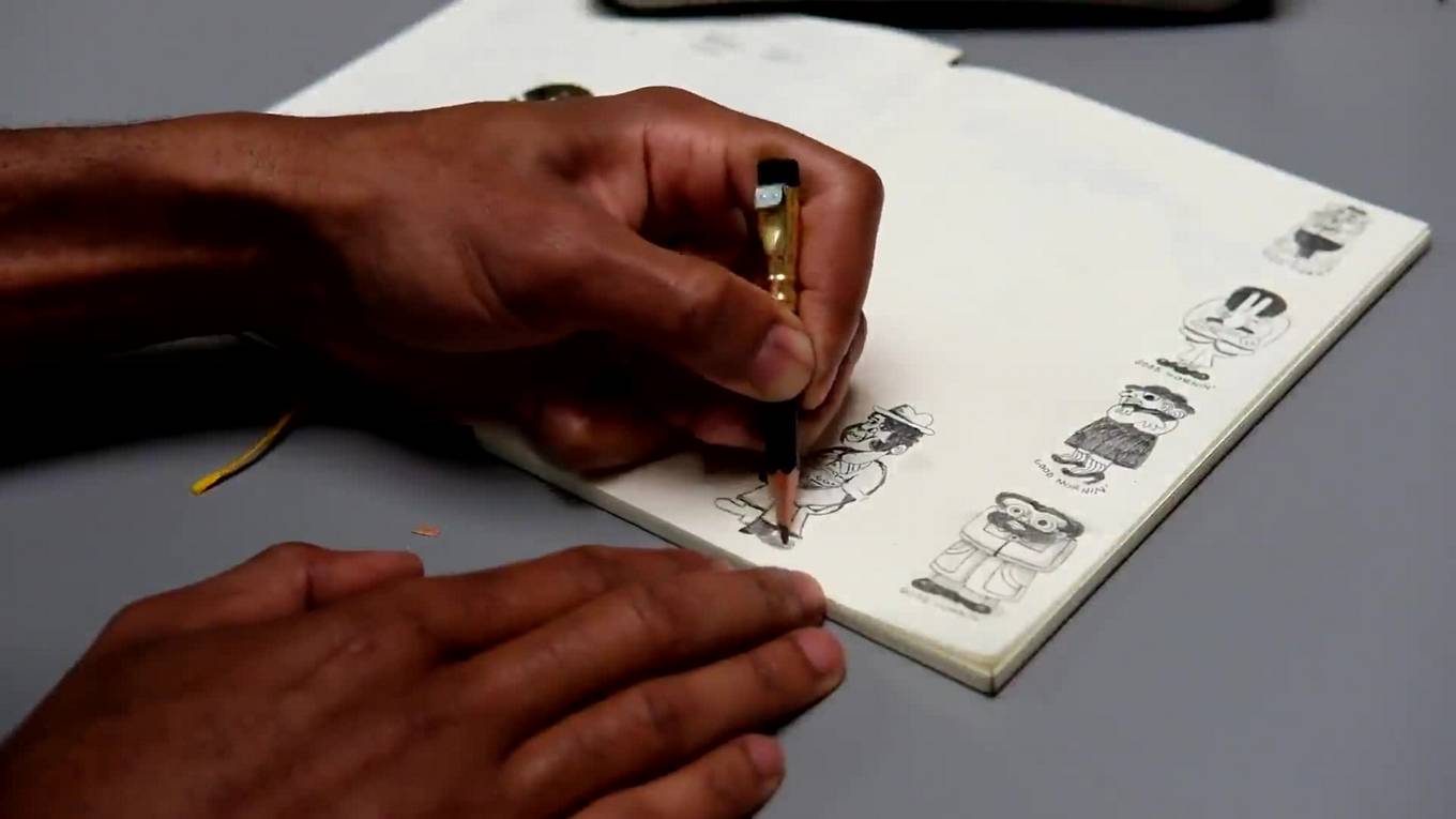 GIF of Joonbug drawing in his sketchbook.