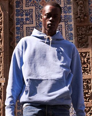 What is garmet dye. Man standing in front of wall.