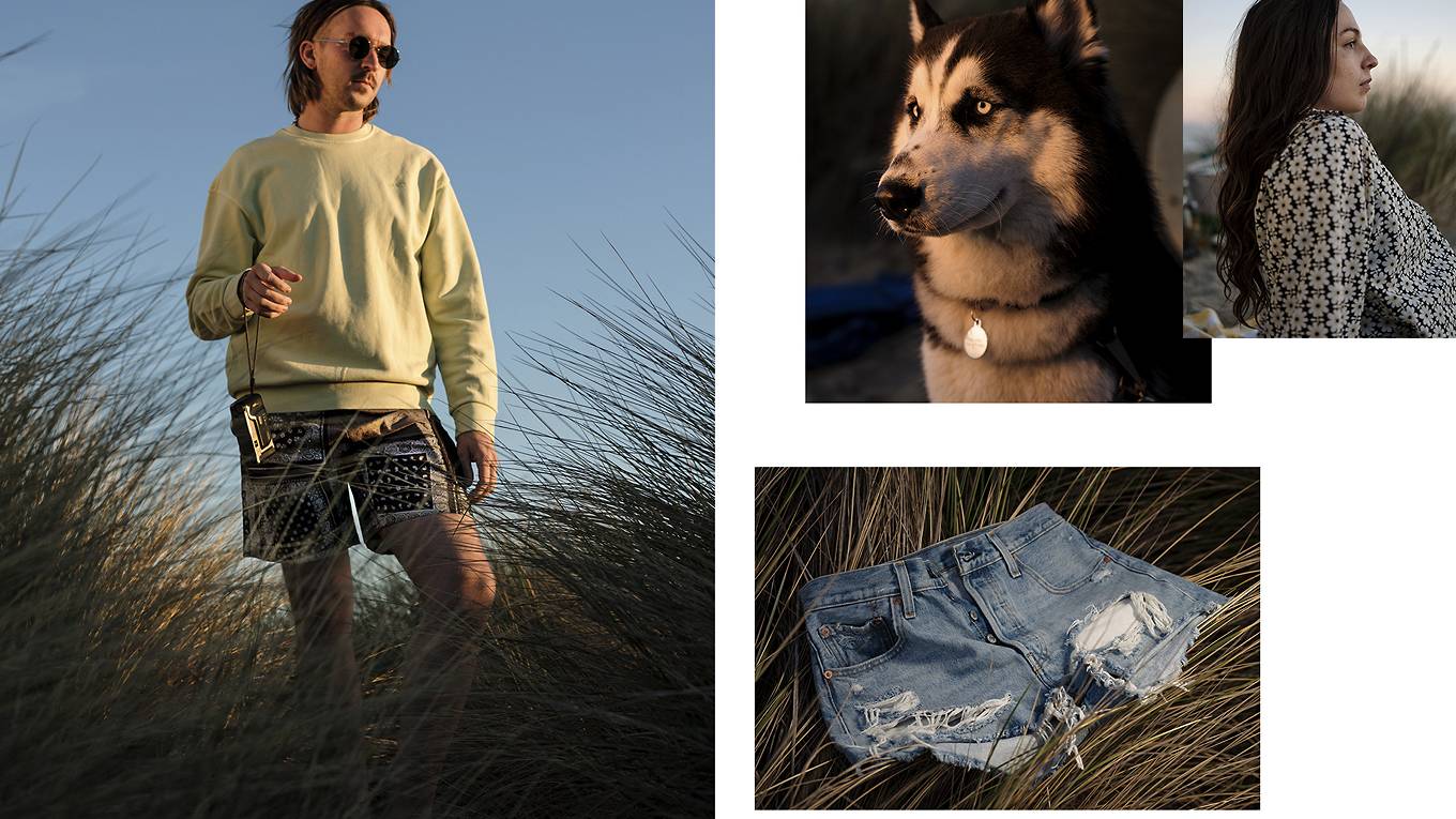 Collage of four images - left image is of a person standing in a grassy field while hanging a film camera on their right arm while wearing a green sweatshirt and paisley shorts. The right side of the collage includes three images: the bottom image is of a pair of denim shorts on top of grass while the upper left image is of a husky and the upper right image is of a woman in a floral blouse while looking out into the distance.