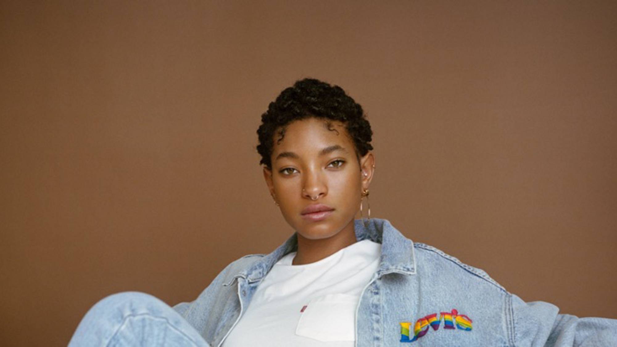 Portrait shot of Willow Smith wearing a Levi's® jean jacket, white tee, and Levi's® jeans.