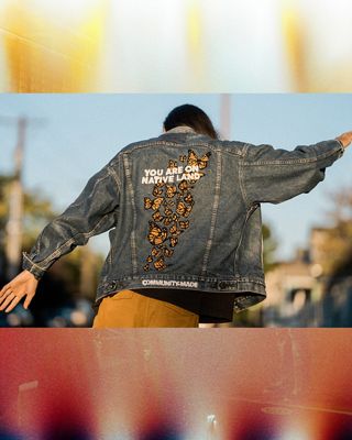 Xiuhtezcatl showing the back of a jean jacket that says "you are on native land"