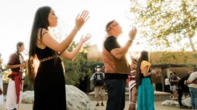 Xiuhtezcatl with friends and family participating  in their native culture rituals