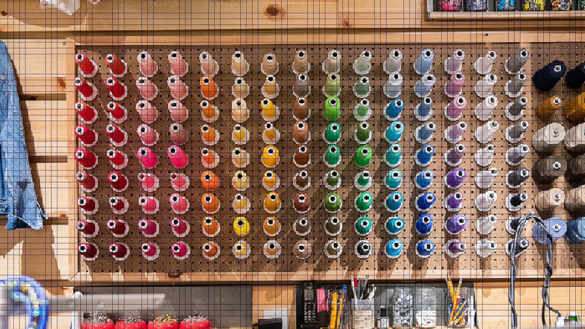 a wall of thread in the tailor shop