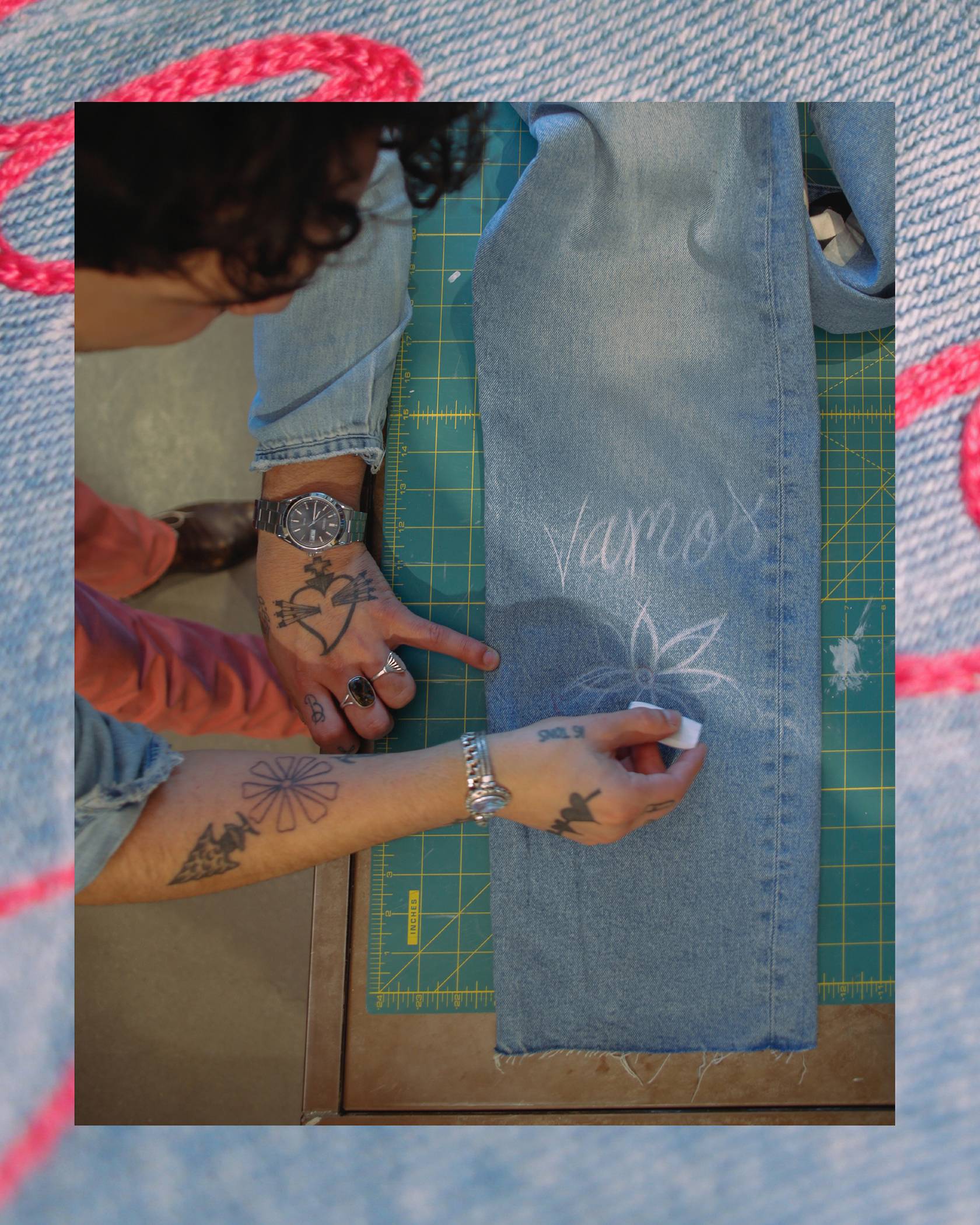 Brian Chavez drawing on jeans