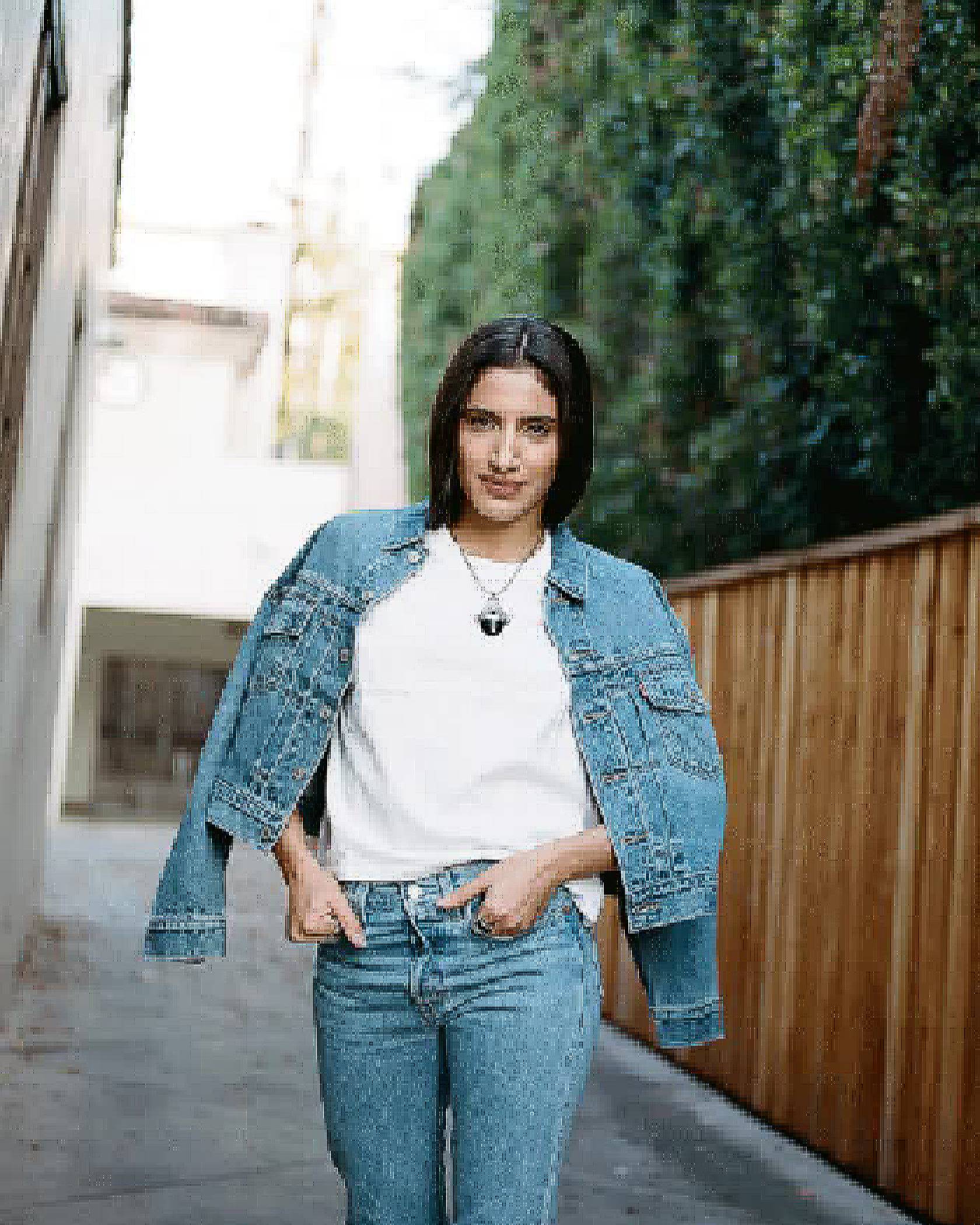 GIFs of ABIR wearing a Levi's Trucker Jacket and jeans outside in LA.
