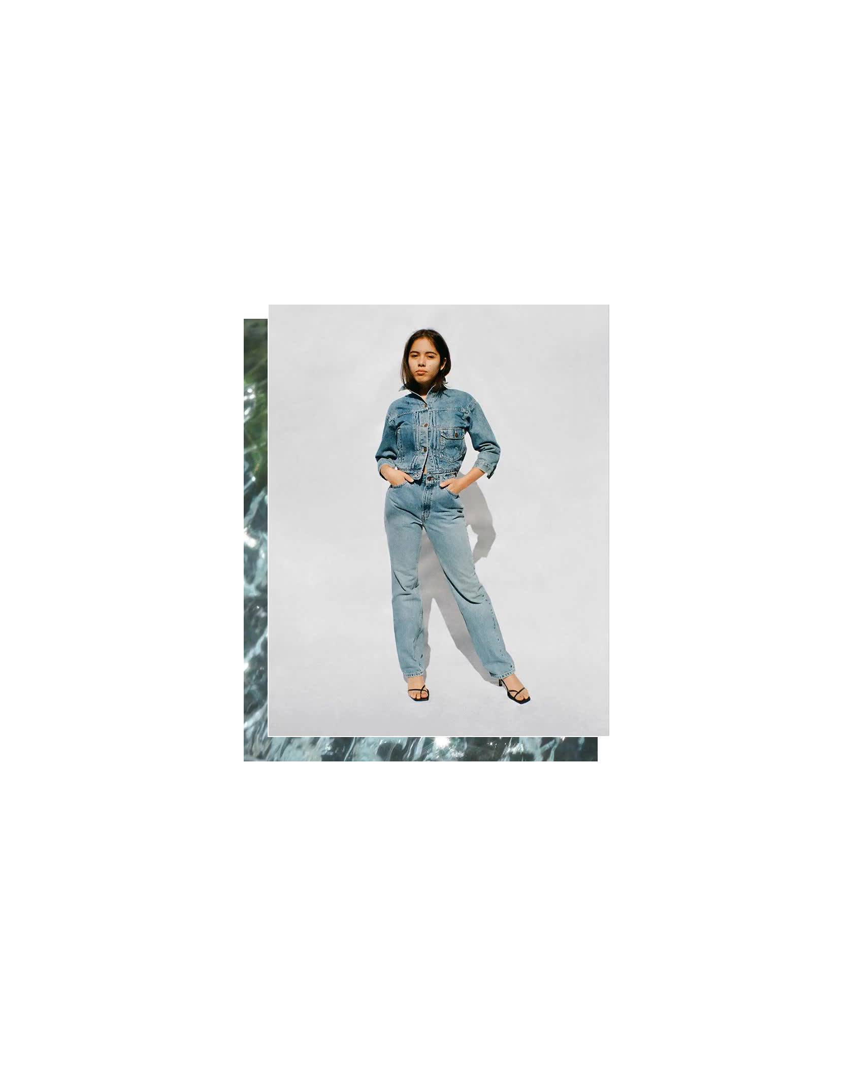 GIF of Xiye Bastida. She is standing against a white backdrop and is wearing a Levi's Trucker Jacket and jeans with black heels.