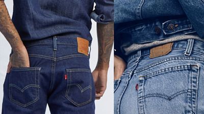 Butts of 2 different pairs of levi's, dark and light wash