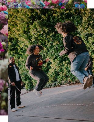 Two women wearing pieces from the Levi's® and Fresco Steez collaboration playing jump rope