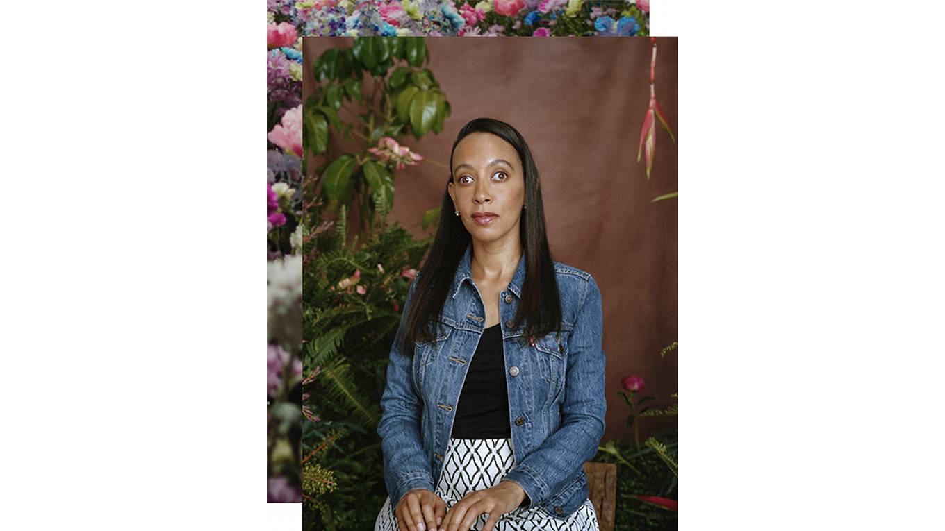 A portrait shot of Haben Girma wearing a jean jacket and white skirt