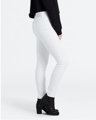 Model wearing white jeans