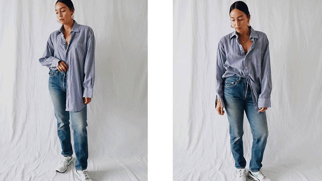 GIF of Rachael Wang. She is standing in front of a white backdrop and is wearing a long blue striped button down, Levi's jeans, and white sneakers.