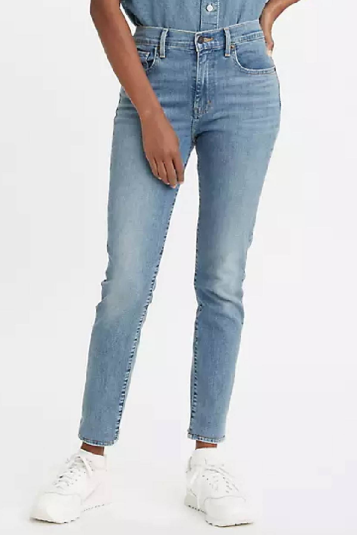 Model wearing 721 high-rise skinny jeans