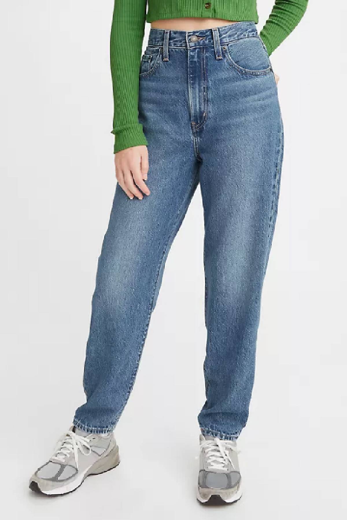 model wearing high loose taper jeans