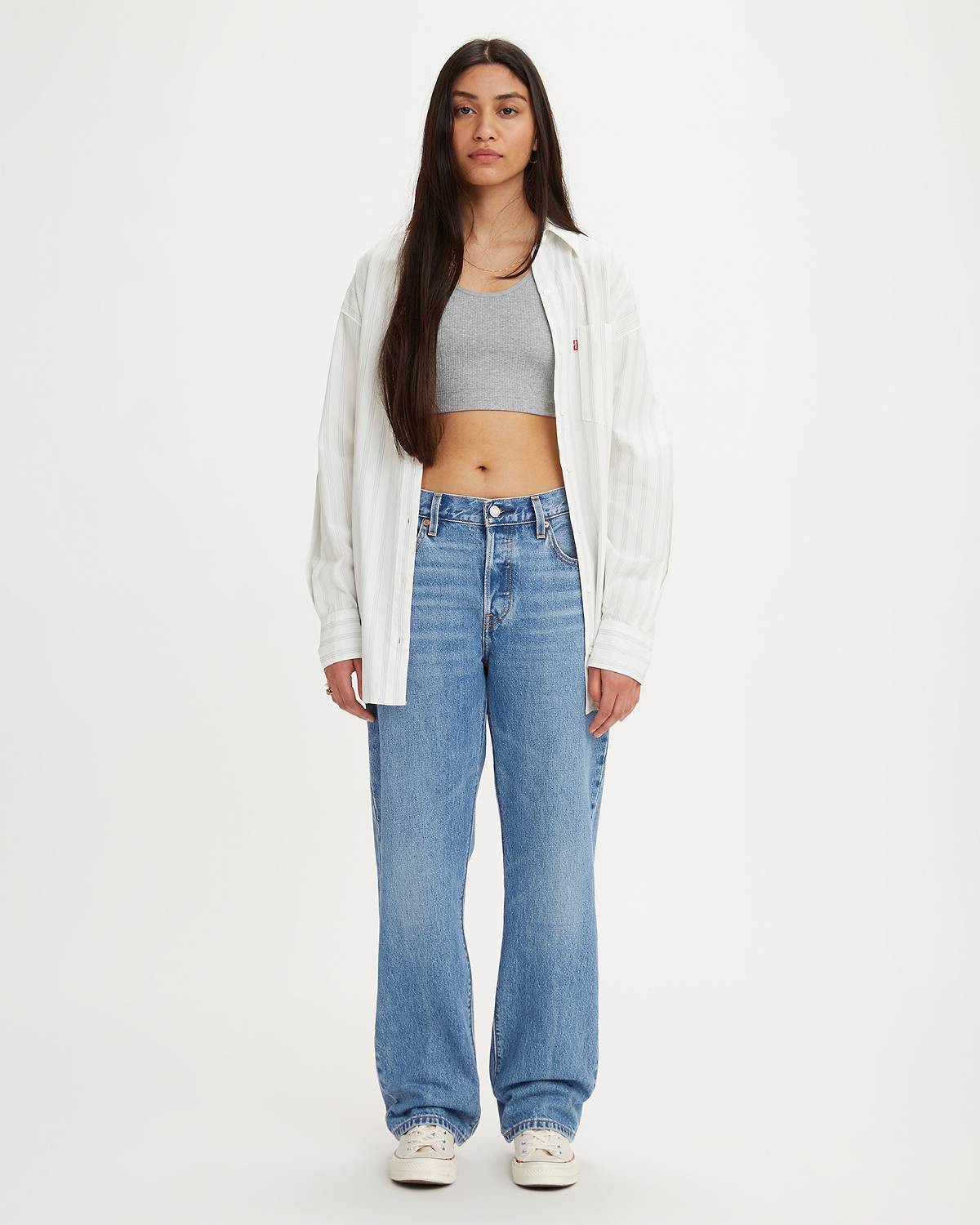 Model wearing medium-wash jeans.
