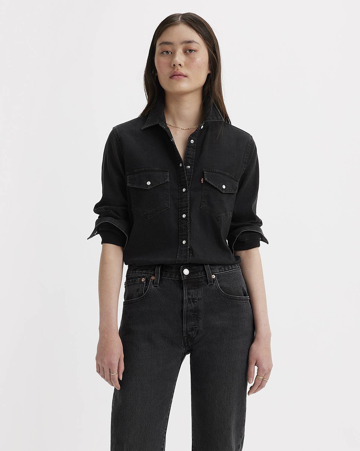 Model wearing black western button-up top.